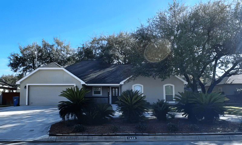 House in Pleasanton, TX with trees trimmed and landscaping redone