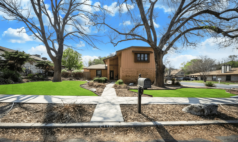 Home in Leon Valley, TX with large tree pruned during winter
