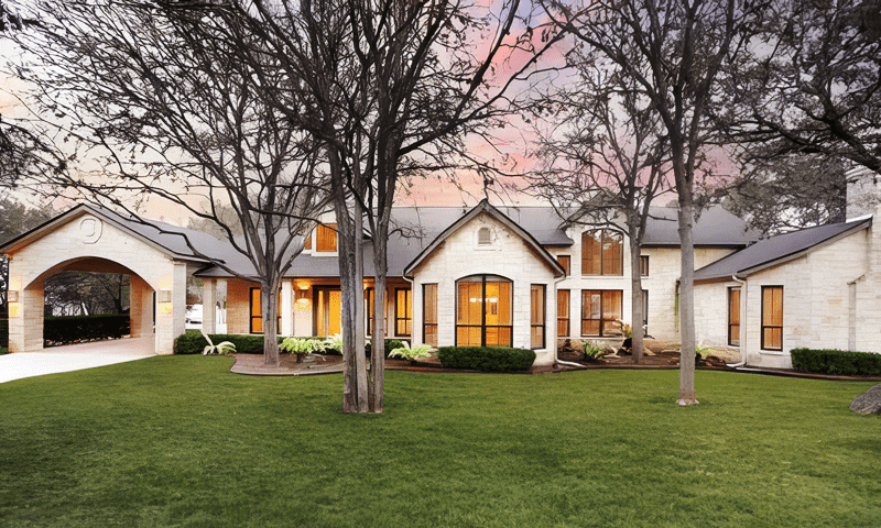 Home in Hollywood Park, TX with trimmed trees in front yard