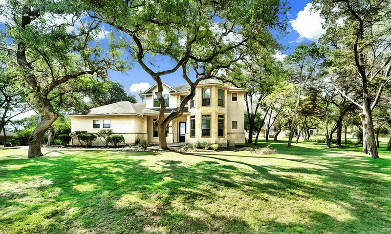 A home with large oak tress recently pruned located in Garden Ridge, TX