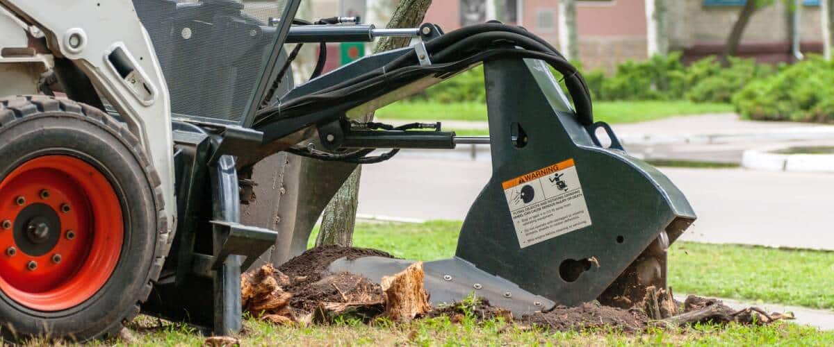 Skid loader with stump grinder attachment (1) Skid loader with stump grinder attachment