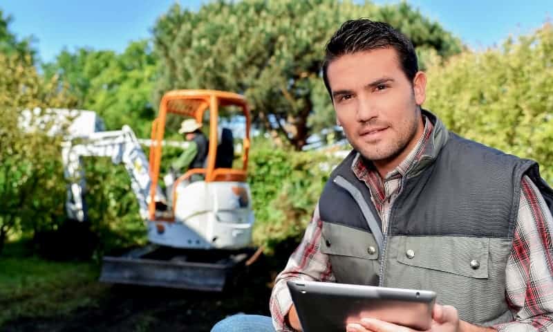 Arborist filling out insurance claim report