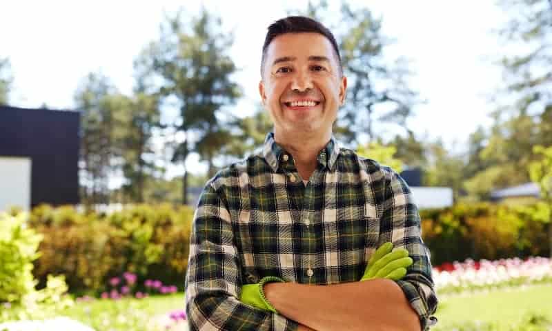 Our tree care specialist smiling at camera