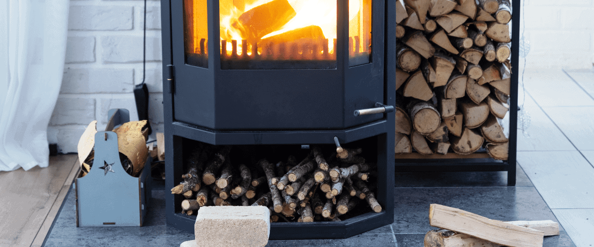 Large fireplace burning firewood